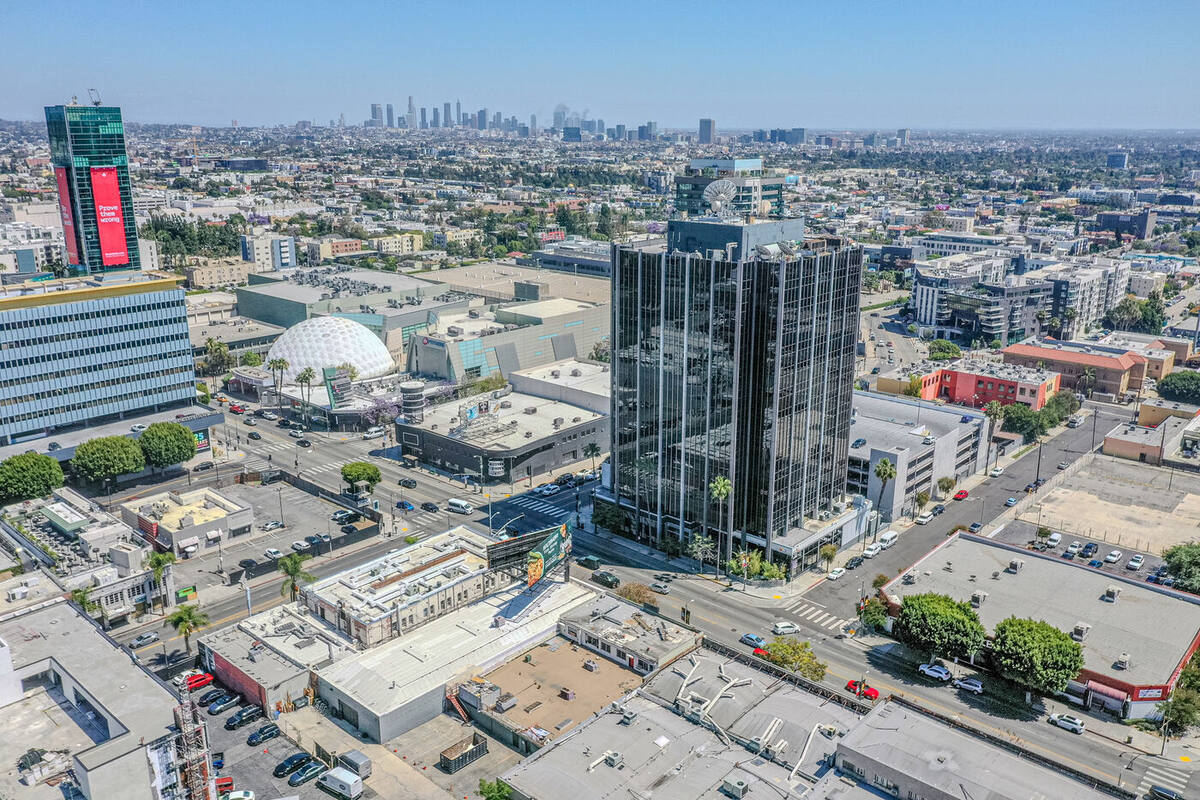 Aerial panoramic view of 6445 W. Sunset Boulevard development site showing the Hollywood corridor, Cinerama Dome, and Downtown LA skyline